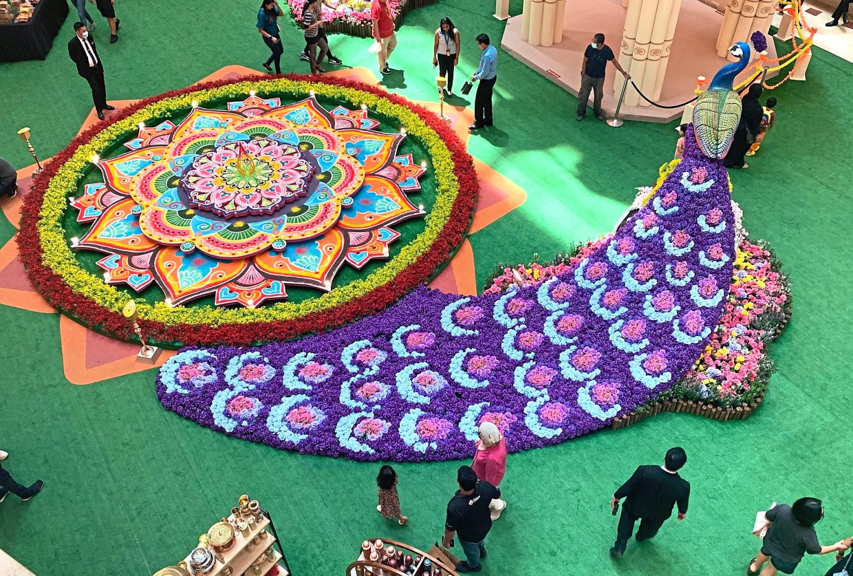 Peacock and rotating ‘kolam’ welcome Suria KLCC visitors