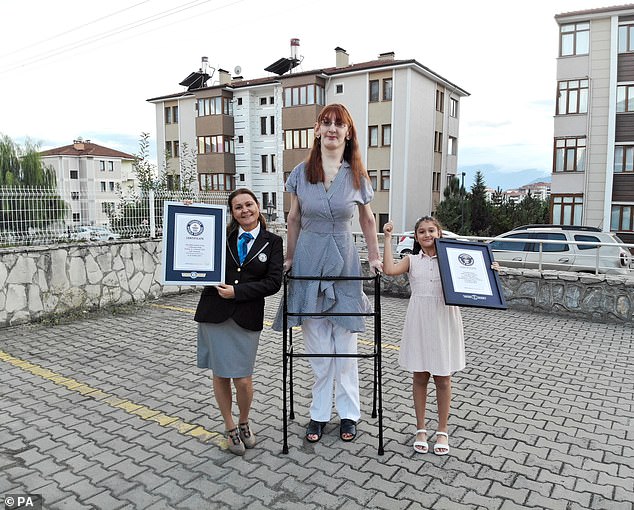 World's tallest woman travels on a plane for the first time after Turkish Airlines removes six seats to make room for her 7ft build on flight to San Francisco