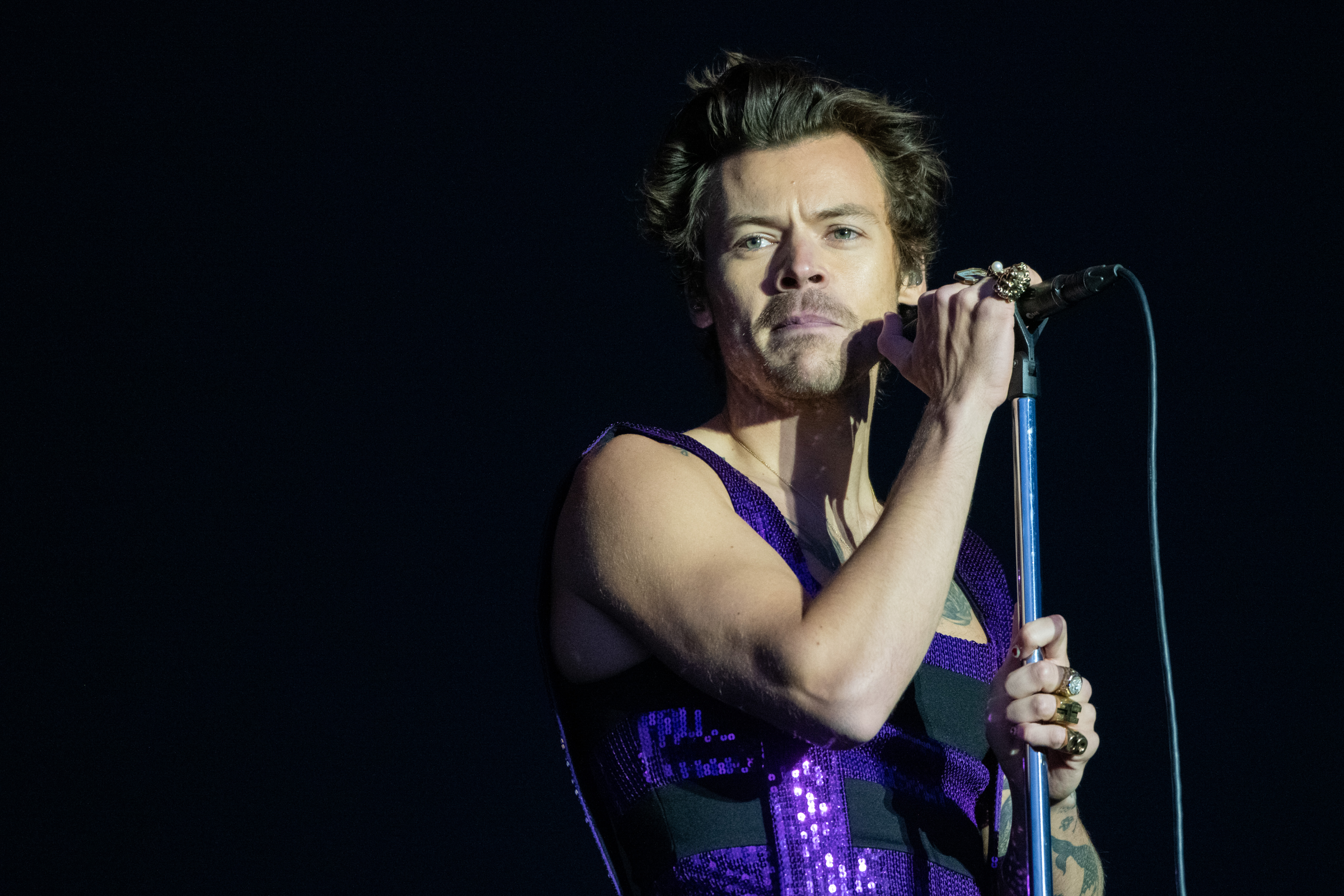 Harry Styles has lucky escape after terrifying moment fan runs on stage before being tackled to ground by security