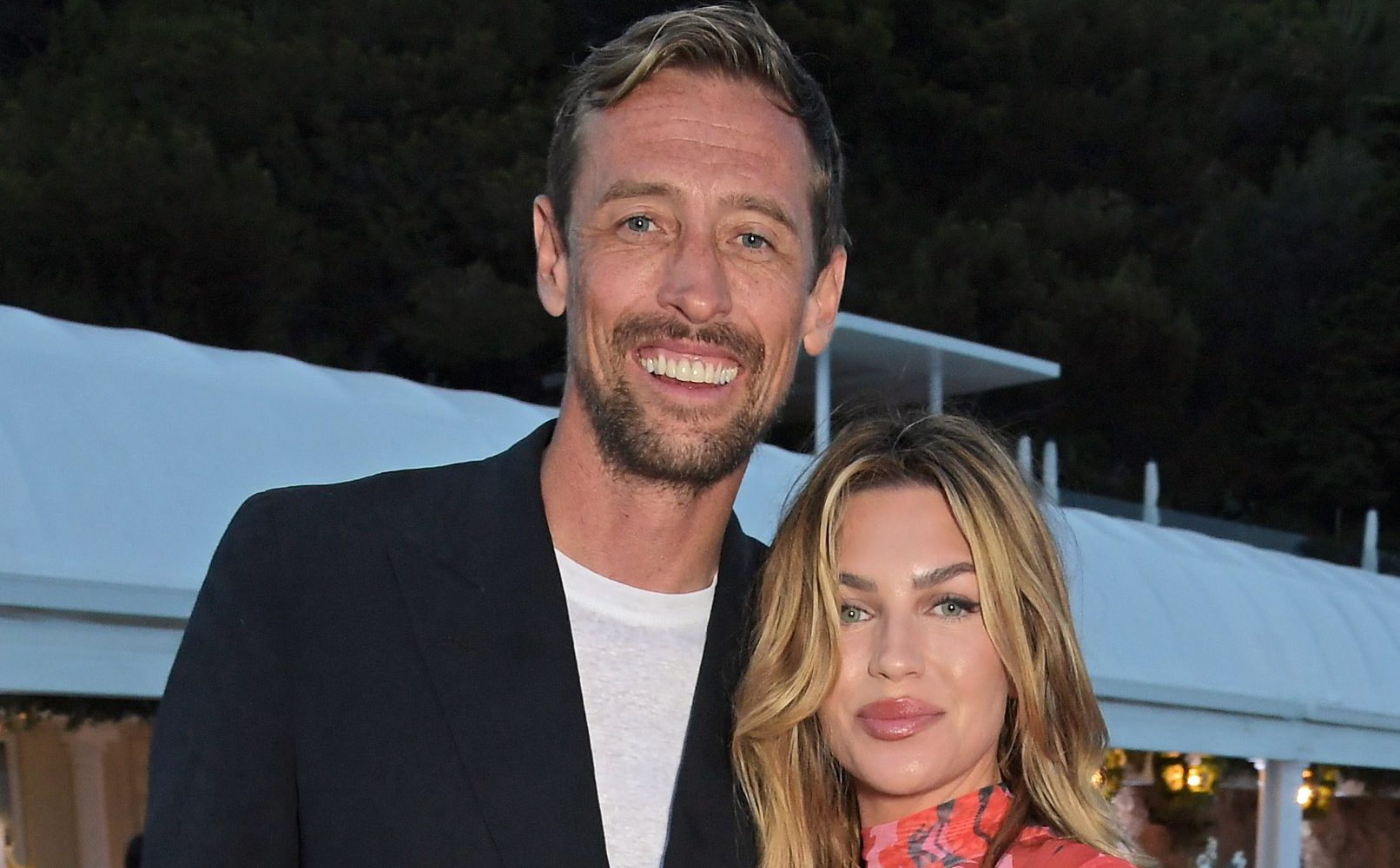 Euphoric Abbey Clancy and Peter Crouch renew wedding vows on Maldives beach with kids