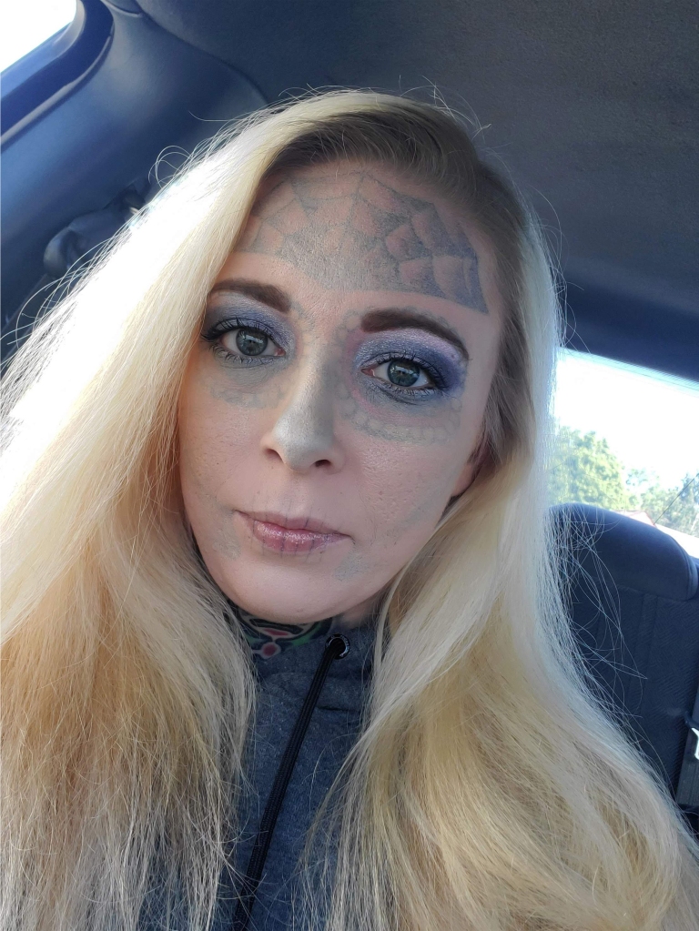 Face-tatted woman from viral mugshots reveals dramatic makeover