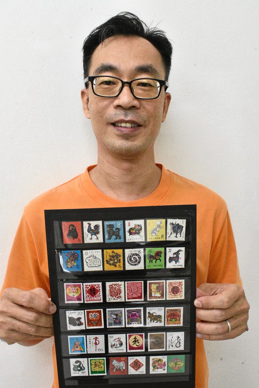 Malaysian stamp collector has over 500 types of zodiac stamps, and counting