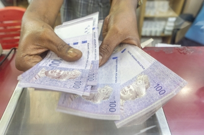 Ringgit pulls back after gains, as US Fed’s cautious tone keeps markets guessing