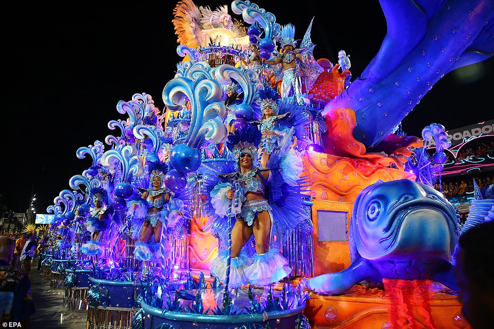 Rio carnival is BACK! Brazil's famous dancers look as flamboyant as ever as the gigantic parade returns in full for the first time since Covid