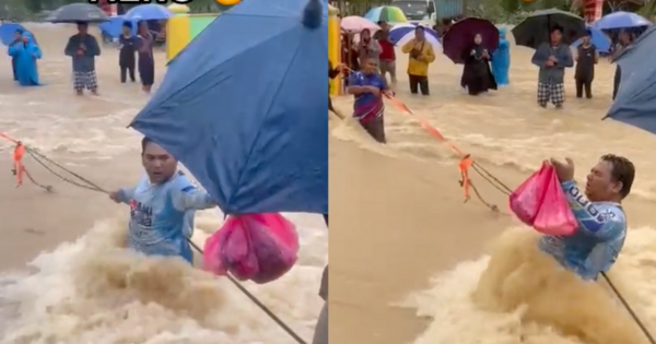 [VIDEO] Man Praised For Fighting Against Strong Tide To Help Flood Victims In Johor