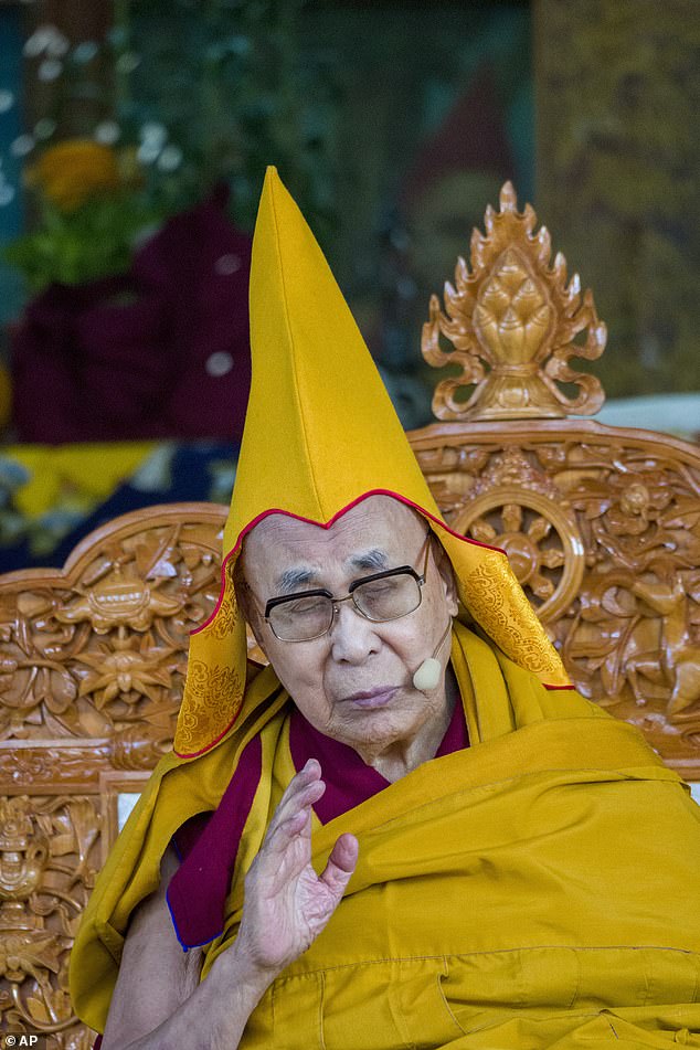 US-born Mongolian child named by Dalai Lama as the reincarnation of Tibetan Buddhism's third most important spiritual leader is pictured for the first time - risking China's fury