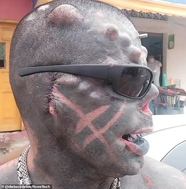 'Human Satan' body modification addict scoops world record for highest number of HORN IMPLANTS in the head