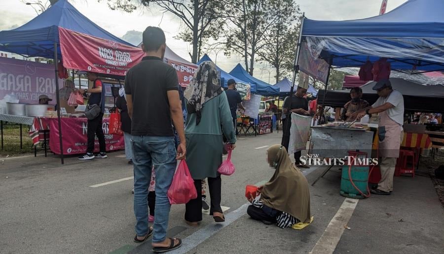 Beggars 'working' traffic light junctions and Ramadan bazaars