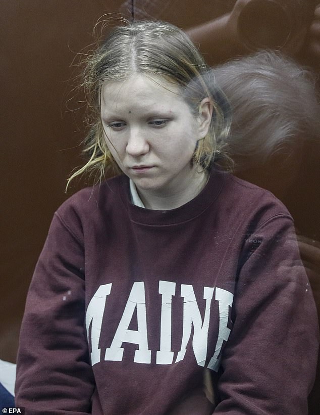 'Statue assassin' Daria Trepova is hauled in to a Russian court and paraded in a glass cage as she faces terrorism charge and decades in jail over blast that killed Putin blogger