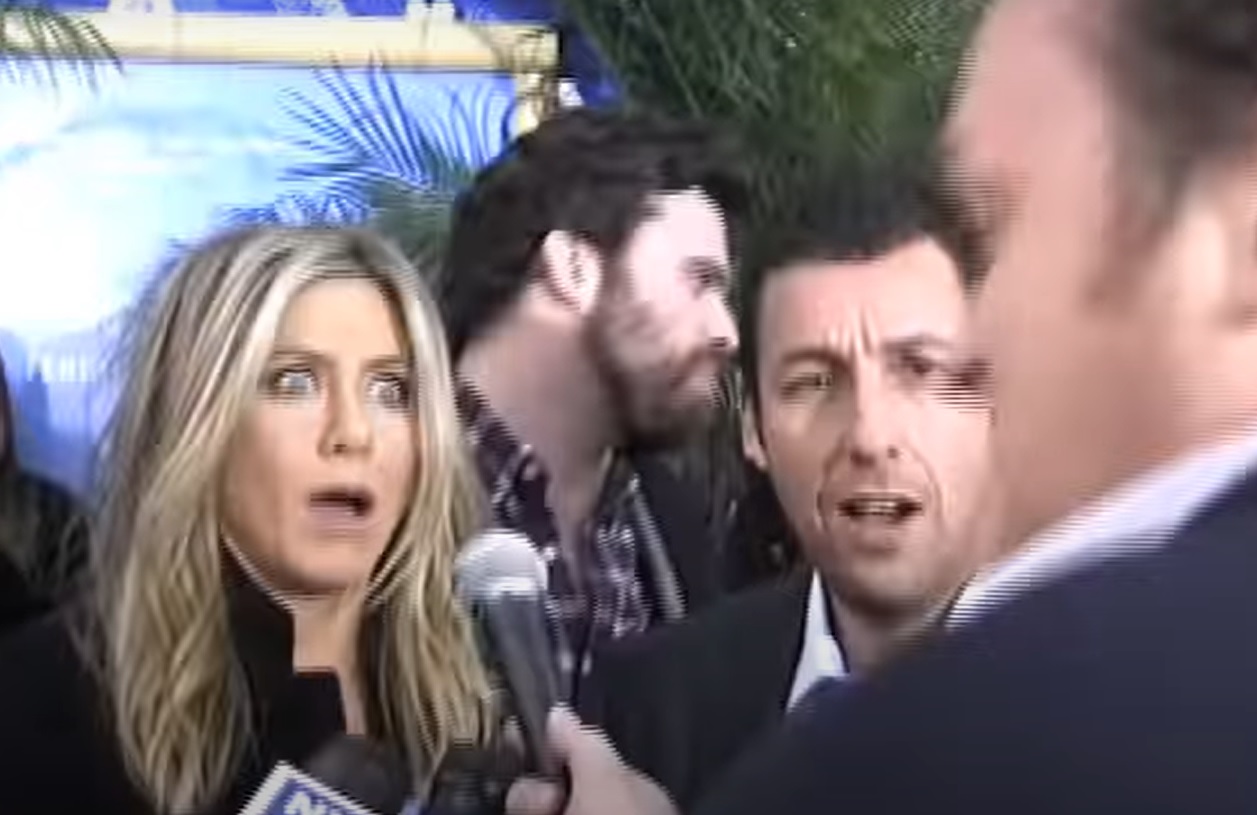 Adam Sandler has perfect Adam Sandler response after extremely tall journalist scares Jennifer Aniston