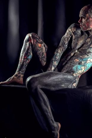 'World's most tattooed man' who removed nipples loves working as primary school teacher
