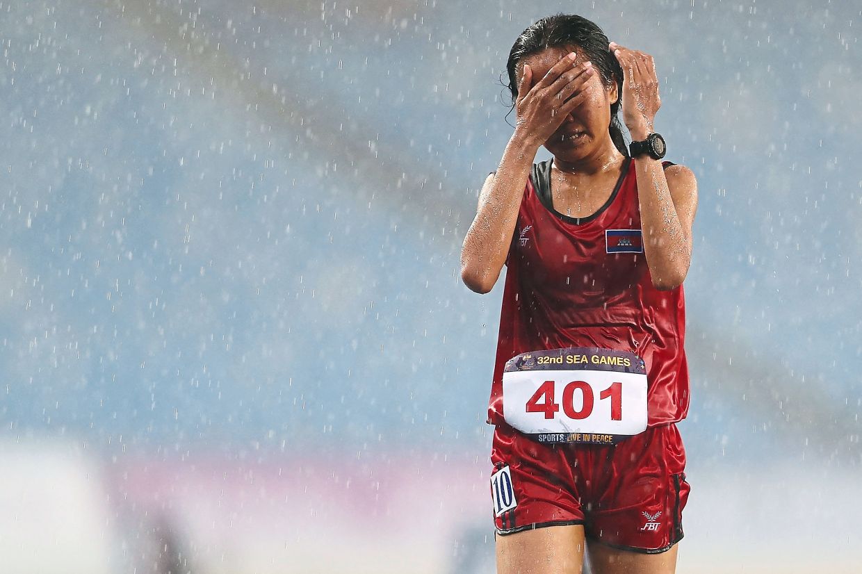 Crying last-placed runner is instant toast and darling of Cambodia