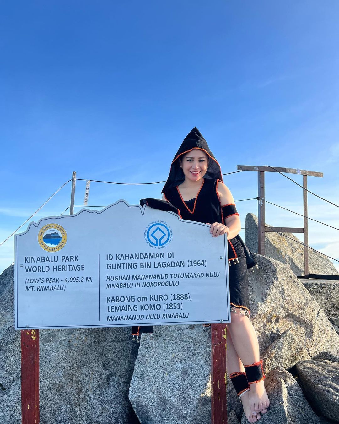 Sabahan Woman Poses At The Top Of Mount Kinabalu In Traditional Dusun Kimaragang Attire