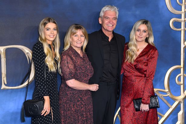 Phillip Schofield's daughters Molly May and Ruby - who 'won't let him out of their sight'