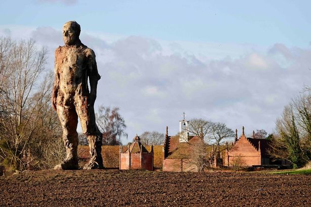Locals slam plan to light up 26ft naked man statue over fears it will distract drivers