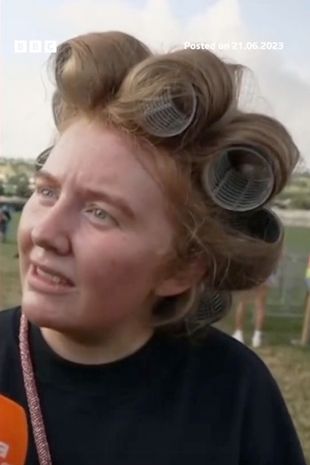 Glastonbury-goer branded 'icon' after awkward TV blunder about hair rollers