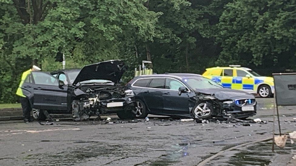 Four injured in crash with unmarked police car and stolen BMW