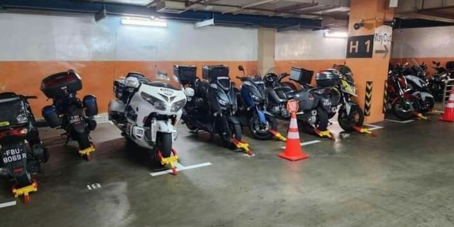Row of motorcycles gets wheel-clamped in nuh carpark for occupying lots meant for cars