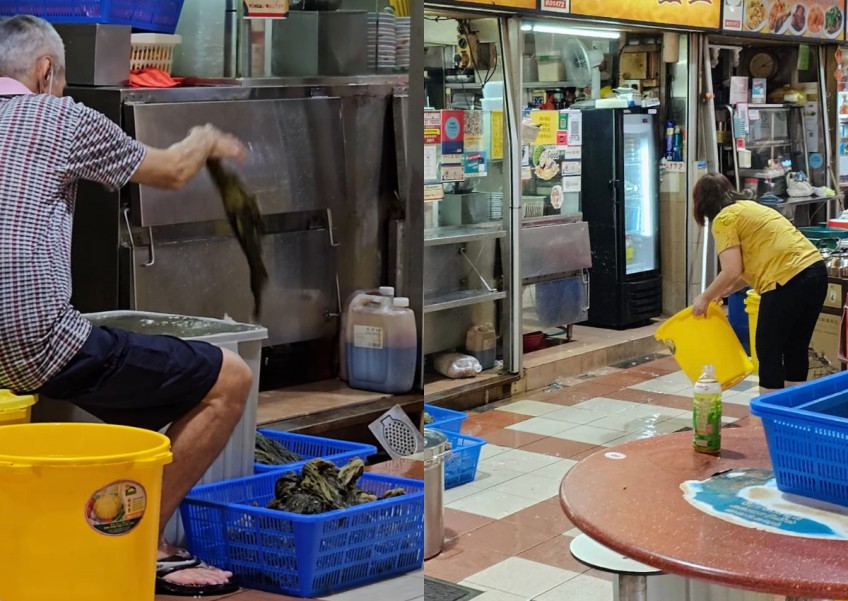 Hawker blasted for leaving vegetables on floor while next-door stall owner washes area
