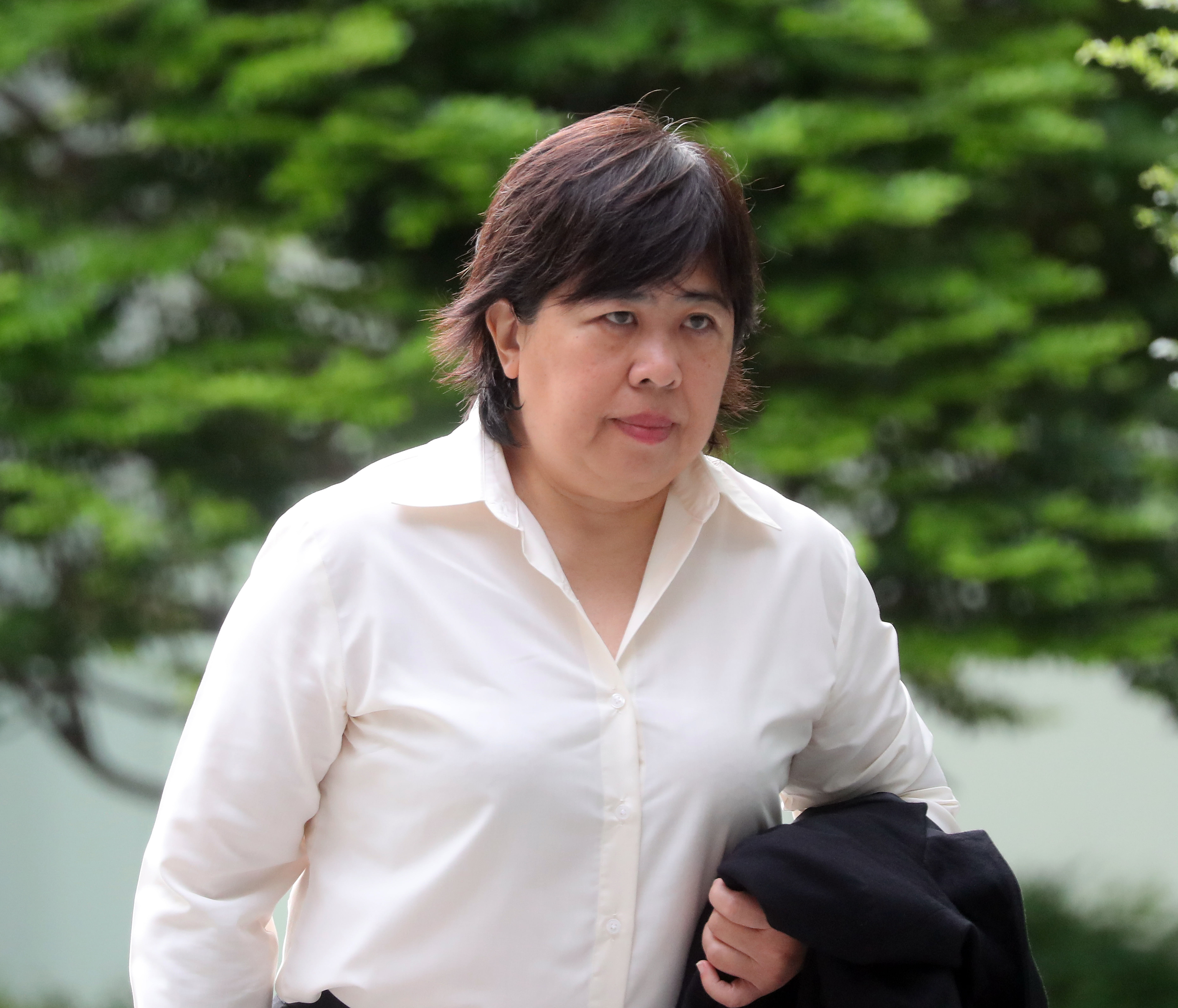 ‘Badge Lady’ convicted of not wearing mask in Orchard Road and not helping in STB investigation