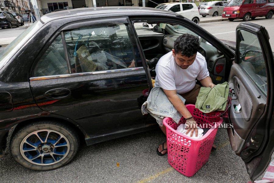 RM1 million in debt, former investor makes car his home