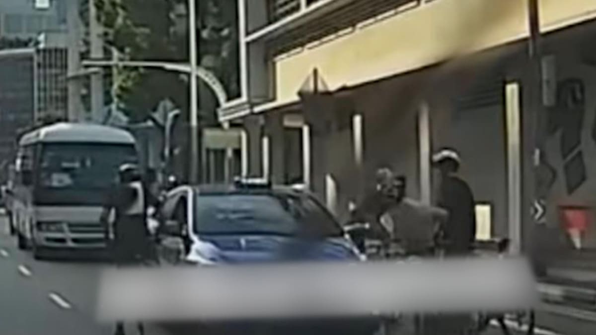 Police investigating after near-collision between cyclists, taxi on Middle Road leads to confrontation
