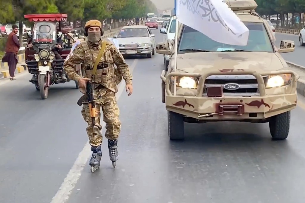 Taliban seen patrolling streets of Kabul on rollerblades with AK-47s