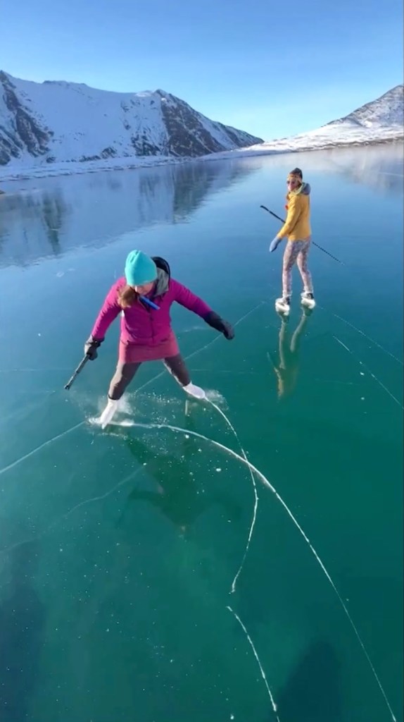 Alaskan couple skates over surreal crystal clear ‘ice window’ that formed over lake