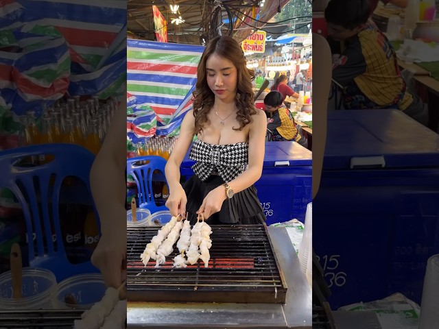 Pretty Thai Girl Sells Grilled Jellyfish At Night Market