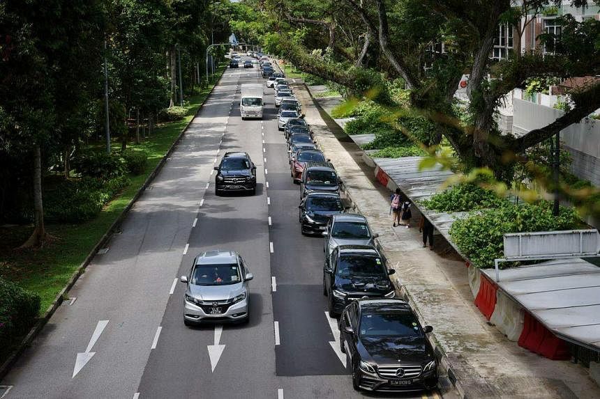 School traffic congestion in Bukit Timah more manageable, but long queues of cars remain