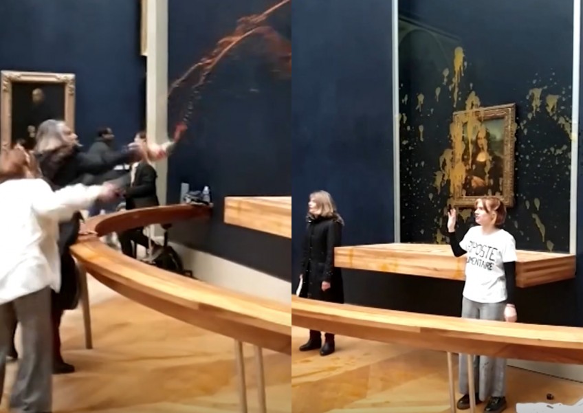 Climate change activists aim soup at Mona Lisa in Paris Louvre