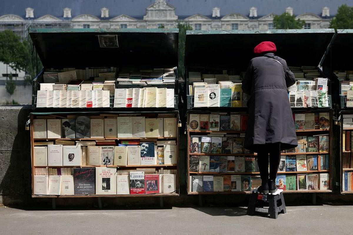 Macron shelves plan to remove riverside Paris booksellers for opening ceremony