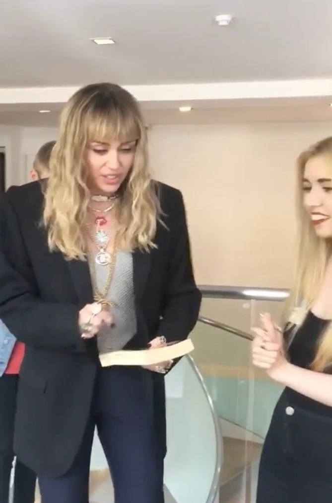 Miley Cyrus slips up big time when asking a fan if they have a pen