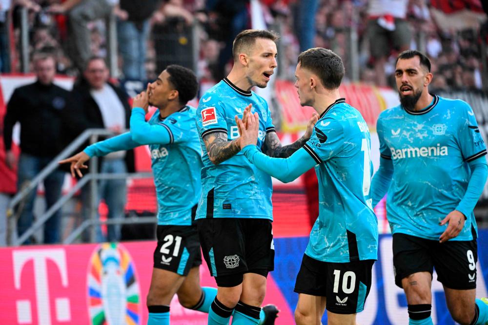 Unstoppable Leverkusen win 2-0 in Cologne to go 10 points clear