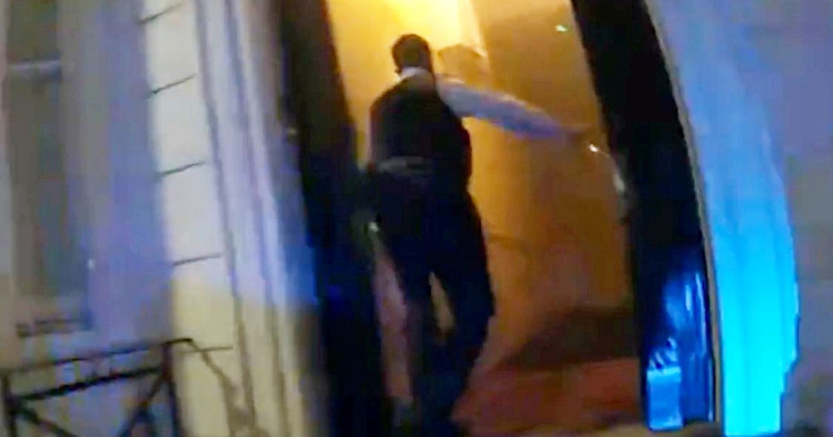 Moment police kick down door of burning building to rescue terrified residents