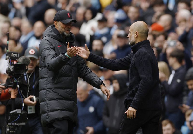 Soccer-Liverpool respect rivals City and best manager in the world Guardiola, Klopp says