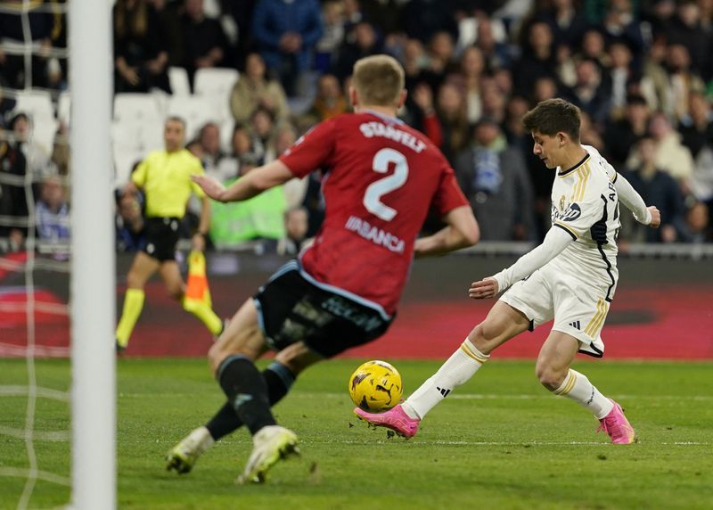 Soccer - Dominant Real Madrid thrash Celta Vigo 4-0 to cement top spot