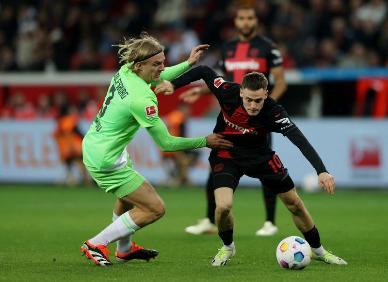 Soccer-Leverkusen stay firmly on course with 2-0 win over Wolfsburg