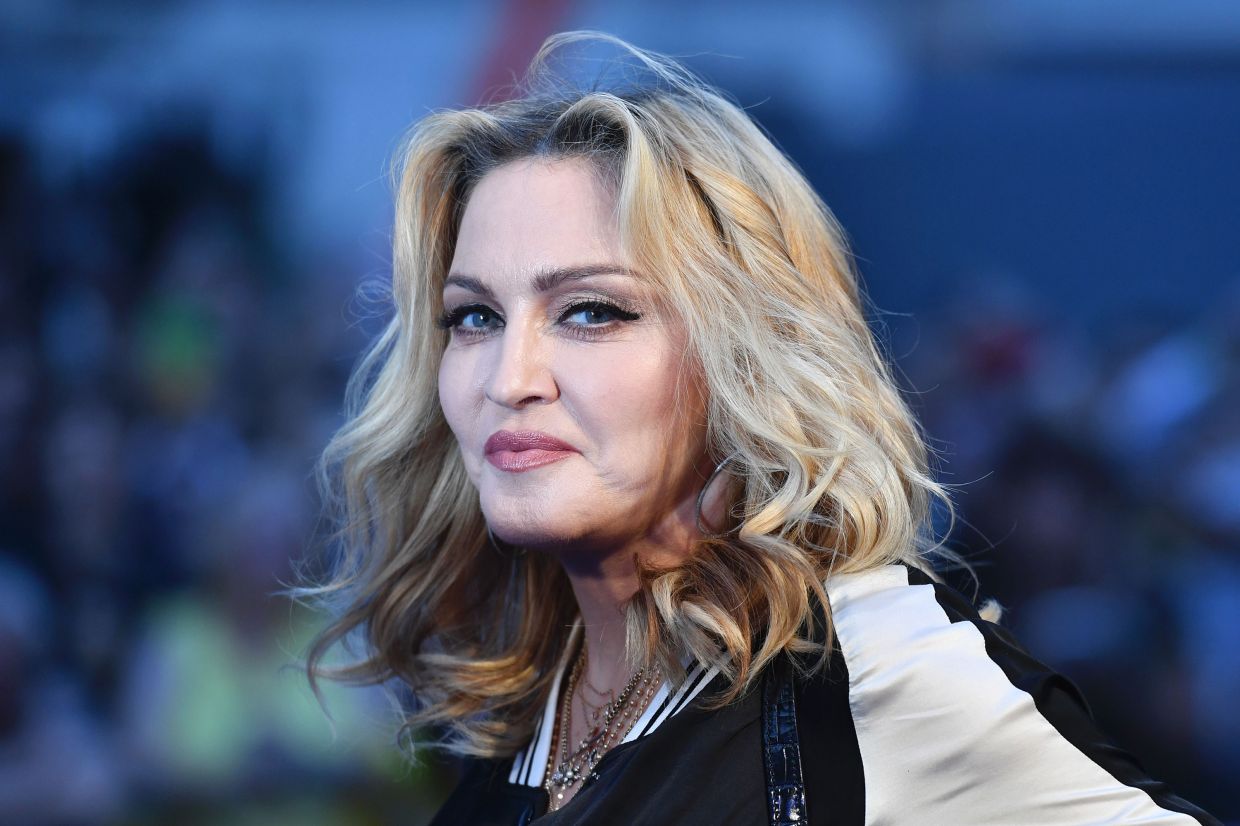 Madonna apologises for telling fan who is in wheelchair to stand at her concert