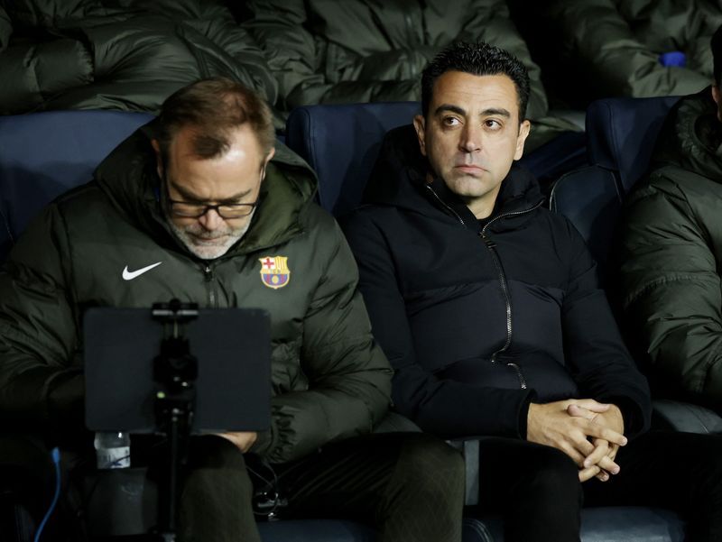 Soccer-Who's laughing now? Xavi hits back at Barca critics