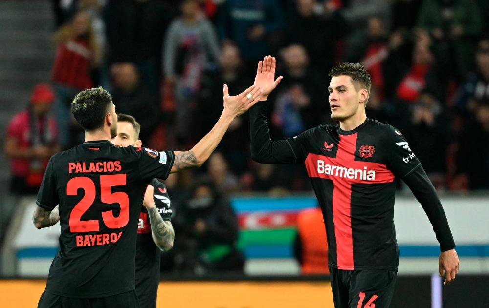 Late Schick double extends Leverkusen’s unbeaten run