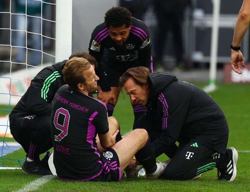 Soccer-Bayern striker Kane travels to England camp for treatment on injured ankle