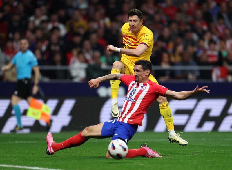 Soccer-Barcelona outclass Atletico Madrid in 3-0 win to climb second