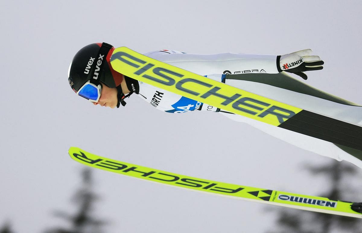 Ski jumping-Bloodied Norwegian Opseth sets world record