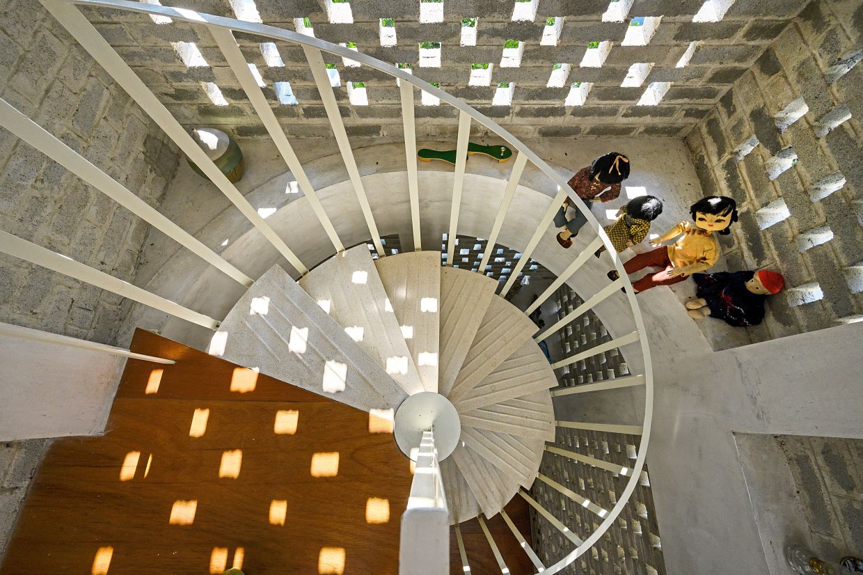 Architect couple's 2-storey terrace house in Malaysia embraces openness and natural elements