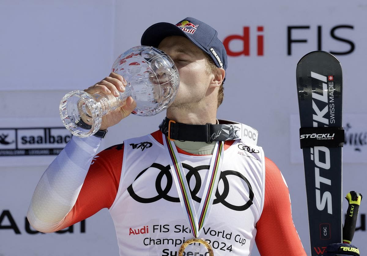 Alpine skiing-Odermatt secures super-G title, third for the season