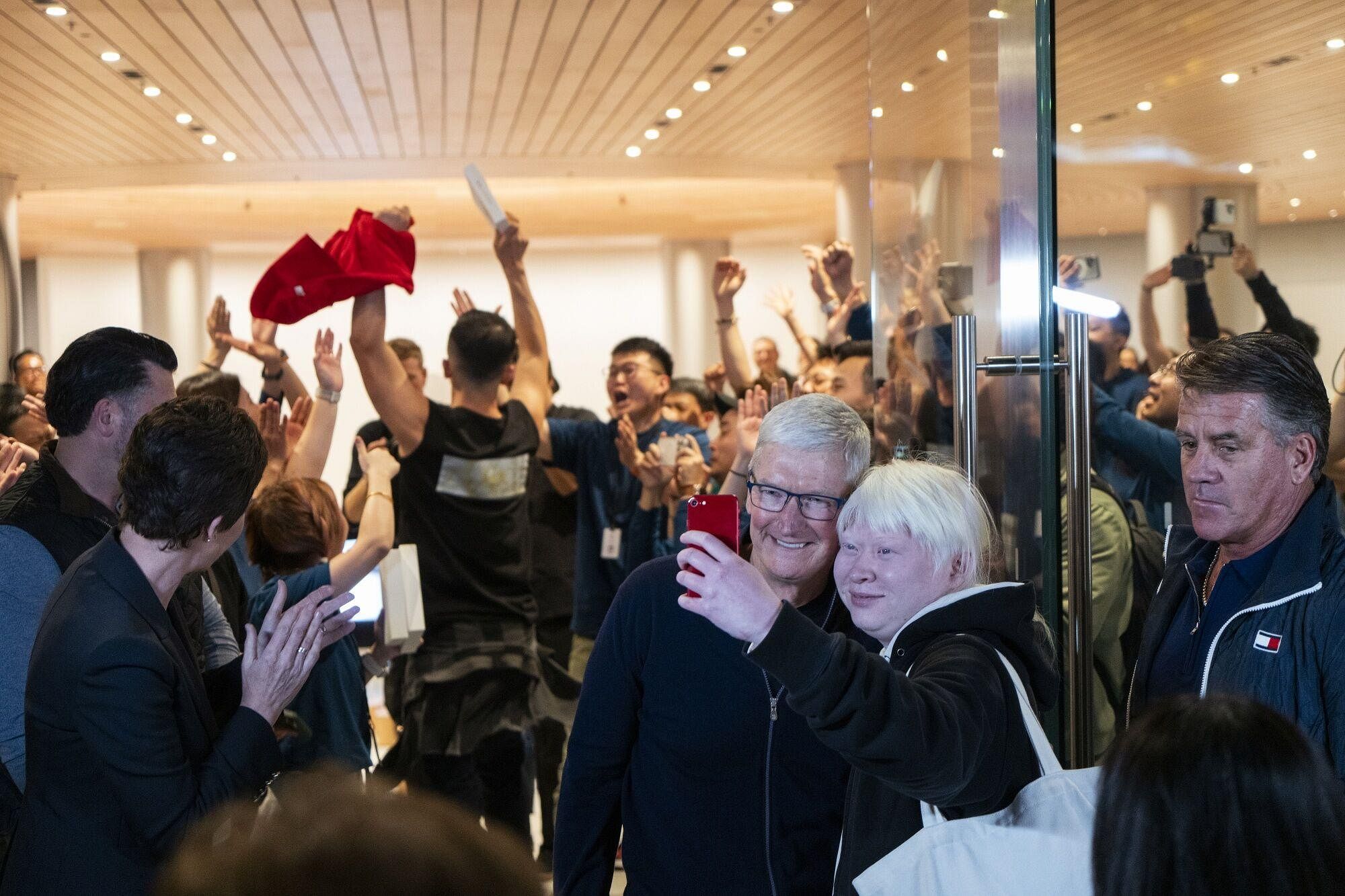 Tim Cook opens new Apple Store in Shanghai to large crowds as China sales fall