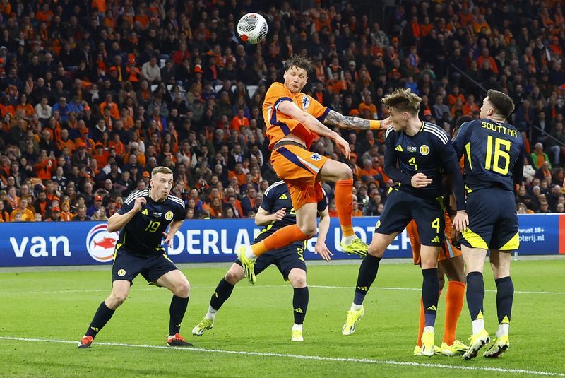 Soccer-Sluggish start no bother for Dutch as they beat Scotland 4-0