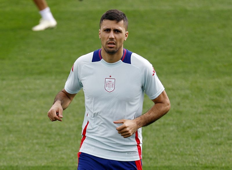 Soccer-Rodri absent from Spain’s practice session before Brazil clash