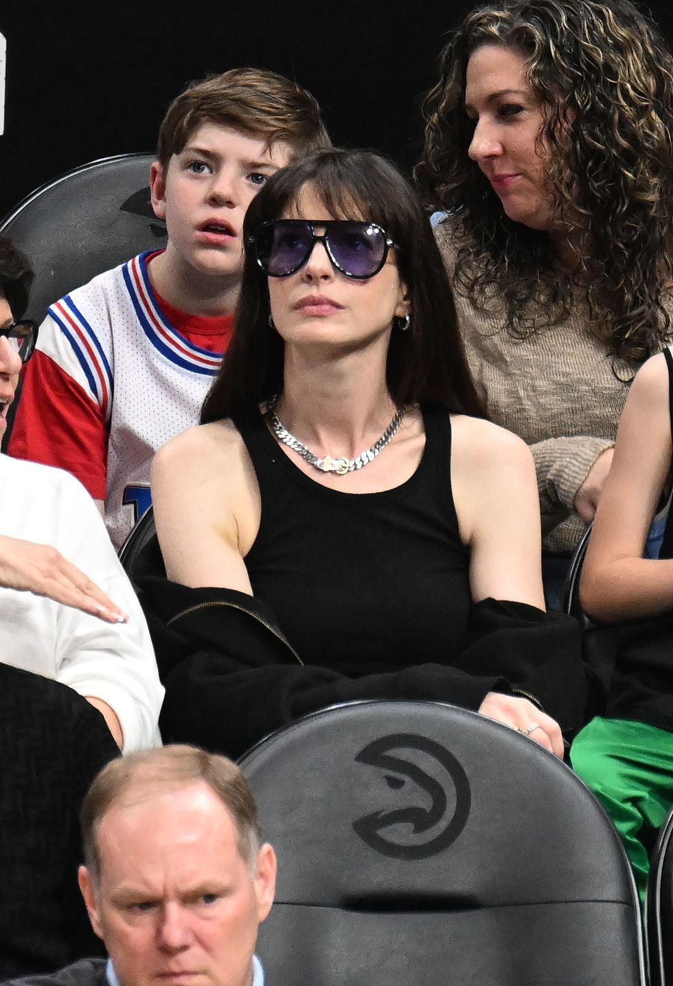Anne Hathaway Nails Courtside Style in an Edgy All-Black Outfit